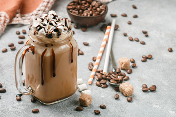 Chocolate frappe coffee with marshmallows and syrup in a Mason jar . Selective focus - 173715912