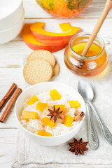 Rice porridge with pumpkin, honey and cinnamon. Healthy Breakfast. Selective focus