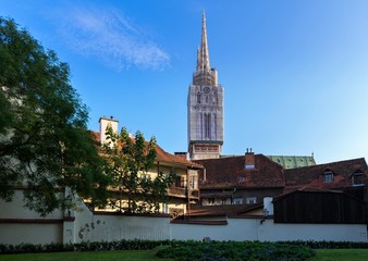 Naklejka premium View of the cathedral towers over old buildings and the fortifications in Zagreb, Croatia