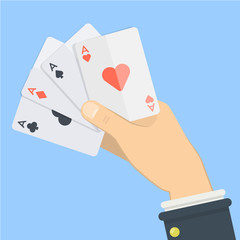 Playing cards in hand.