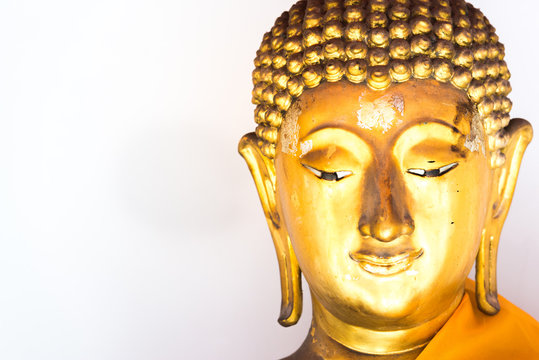 face of Buddha statue with white background