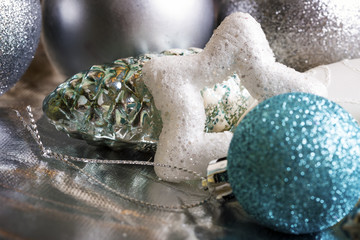 New year silver decoration on briliance background. Top view