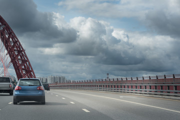 Highway interchange with bridge and clouds on the background