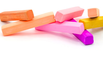 Colorful square pastel chalks on white background