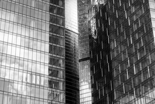 Reflection of a building in the windows of a large business building. Black and white. © Mak