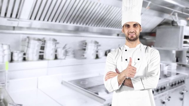 Young Caucasian chef showing thumb up while wearing uniform in the kitchen room