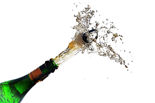 champagne bottle explosion with cork popping splash isolated against a white background, copy space, selected focus, motion blur