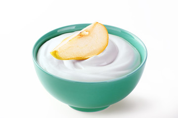 cream sour with slice of pear in bowl