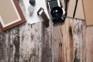 Camera and supplies, Blank photo frames on wood