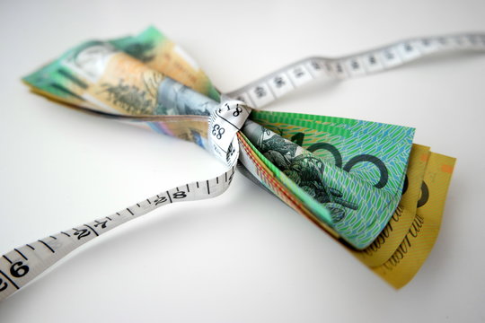Tape measure tightly wrap Australian banknotes