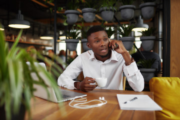African businessman discussing talking at call phone.