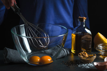 Whisk for beating in hand, ingredients for mayonnaise