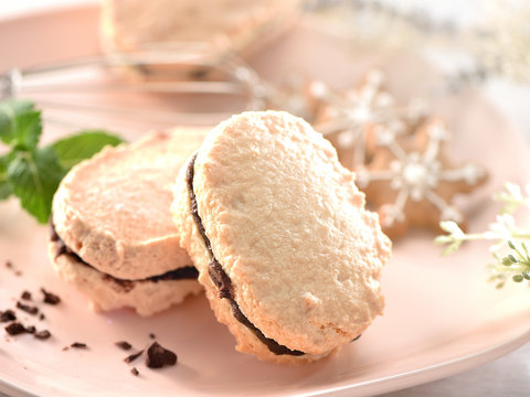 Dacquoise (French pronunciation) is a dessert cake made with layers of almond and hazelnut meringue and whipped cream or buttercream.
