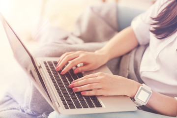 Close up of female hands that being on the keyboard