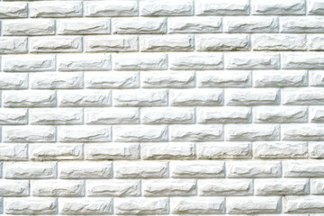 Texture of white brick wall surface with cement and concrete seams