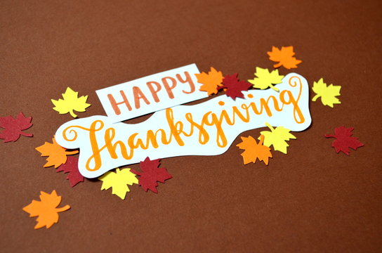HAPPY THANKSGIVING hand lettered paper card with autumn leaves