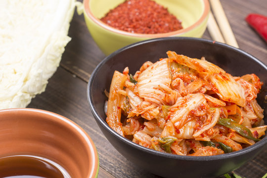 Kimchi or kimchee on black plate