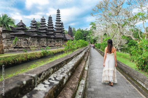 Asian Girl Walking In Pura Taman Ayun Temple In Bali