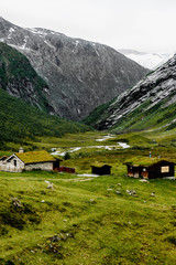 Fototapeta na wymiar Old abandonned mountain village with colorful houses in a valley in Norway