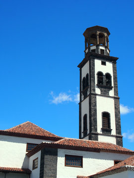 the old church in santa cruz tenerife with bell tower and blue sky