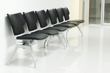 Black chairs in the waiting room
