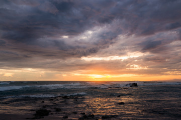Fototapeta premium Sea scape waves sunset light glow and cloudy sky
