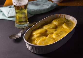 Potato gratin with beer - Food background