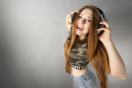 Teen women wearing headphones