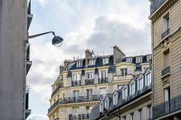 Fototapeta na wymiar Haussmannian style residential buildings in Paris, France.