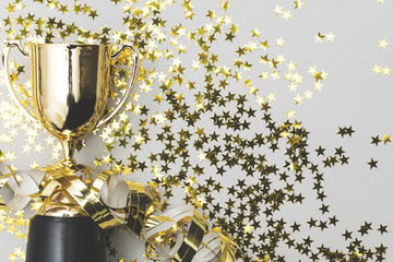 Gold winners trophy with golden shiny stars