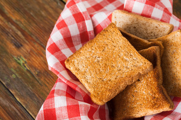 Breakfast background, toasts on checkered napkin closeup