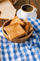 Breakfast background, toast and coffee on rustic wood