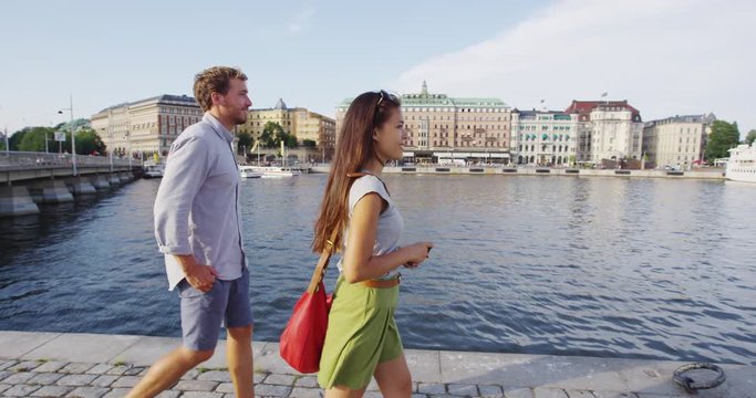 People in Stockholm Sweden - Young couple walking downtown. Man and woman in love enjoying walk in Stockholm, Sweden, Scandinavia.