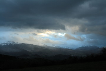 Dramatic landscape wtith cloudy sky in the French Pyrenees. Occitanie in south of France