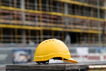 Yellow safety hardhat. Side view