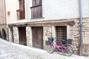 Fototapeta na wymiar bike on a wall supported in a village, Spain