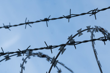 Fototapeta na wymiar Fence with barbed wire