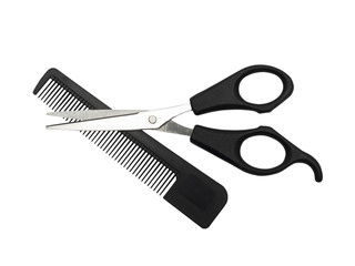 Haircutting scissors and hairbrush.