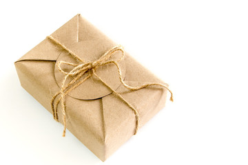 Gift box wrapped in kraft paper and rustic hemp as natural rustic style