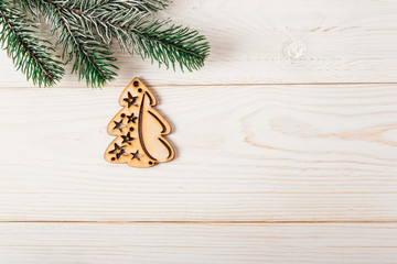 Christmas fir branch and christmas tree shape.New year,Christmas  concept.Space for text.Wooden background.Top view,flat lay.