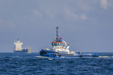TUG AND SHIP - Sea traffic on the waterway © Wojciech Wrzesień