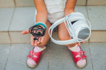 black and white headphones on the hands