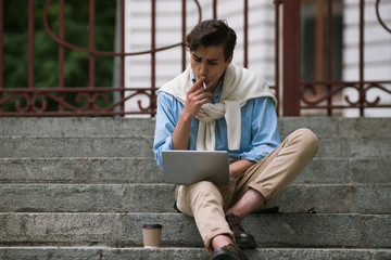 Modern communication. Male with bad habits. Remote work, student coffee break, freelancer outdoors,...