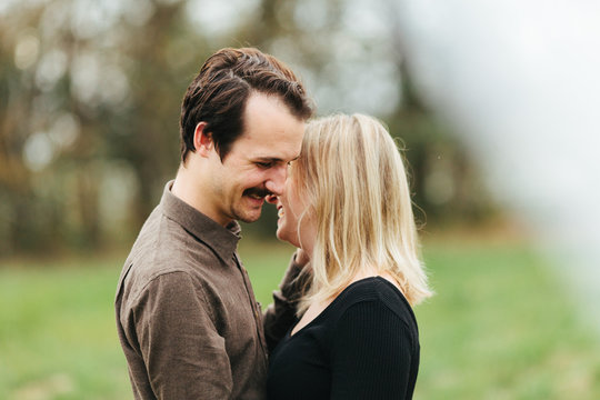 A young hipster couple giggling together