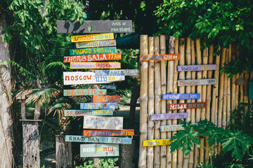 Many signposts with direction and distance 