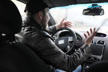 Man driving a car in the process