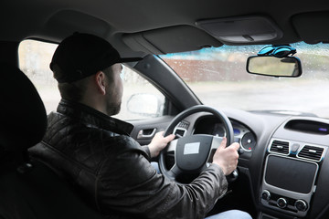 Man driving a car in the process
