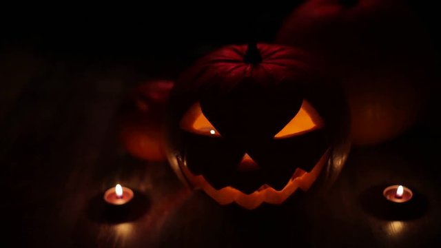 halloween jack-o-lantern burning in darkness