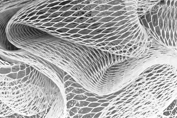 Closeup macrophotograph of plastic mesh material