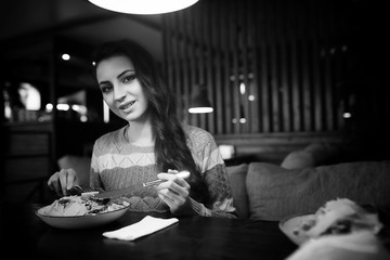 Girl in a cafe at a dinner